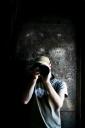 Me, holding a Canon Eos 400d/Digital Rebel xTi with 300mm Nikon Lens