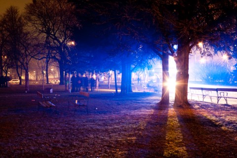 One of many ambulances that I saw that night colors the fog blue.