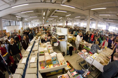 A view of the main hall with a big crowd of people.