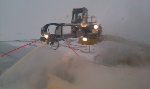 The de-icing truck, blasting anti-frost stuff on the airplane.
