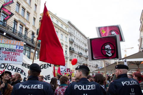 The protest behind a wall of policemen.