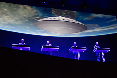 Kraftwerk playing with some extra-fancy CG-Evoluon on the background.