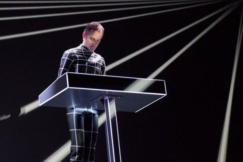 A Kraftwerk band member playing music.