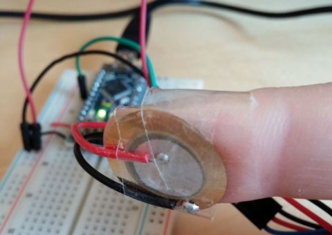 Piezo sensor taped to finger